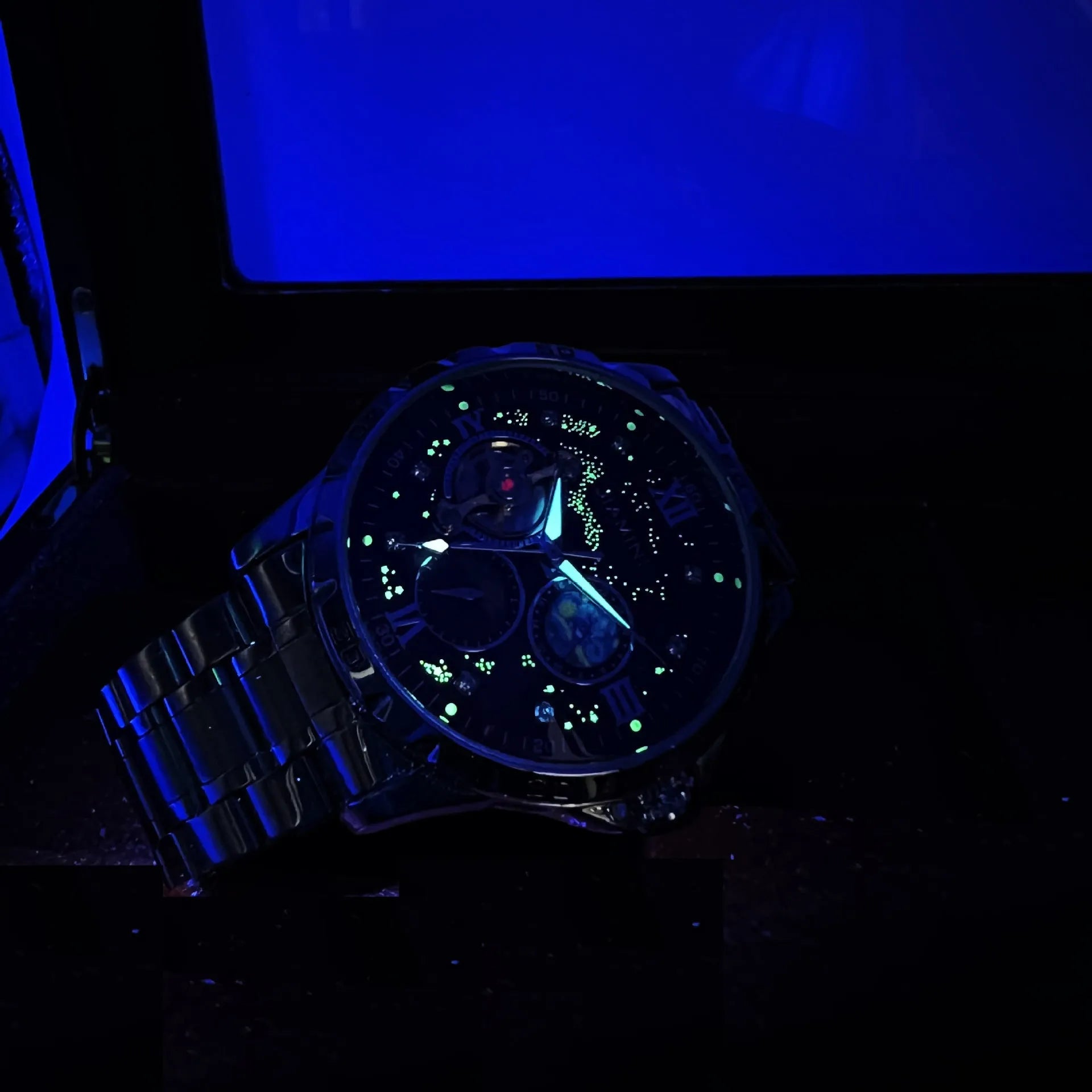 Men's automatic mechanical watch with rose gold shell, black dial, and large multifunctional display.