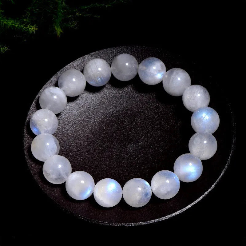 Natural blue moonlight moonstone round bead bracelet on wrist showing geometric arrangement