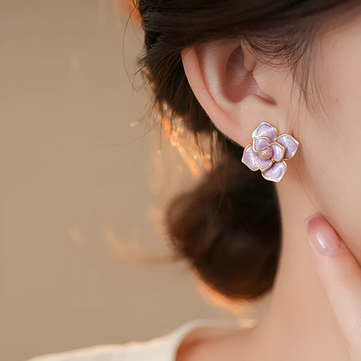 Purple oil-spot glaze floral copper stud earrings with gold-plated silver needle on white background