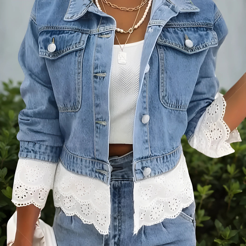 Blue women's denim jacket with decorative lace stitching on the front, long sleeves.