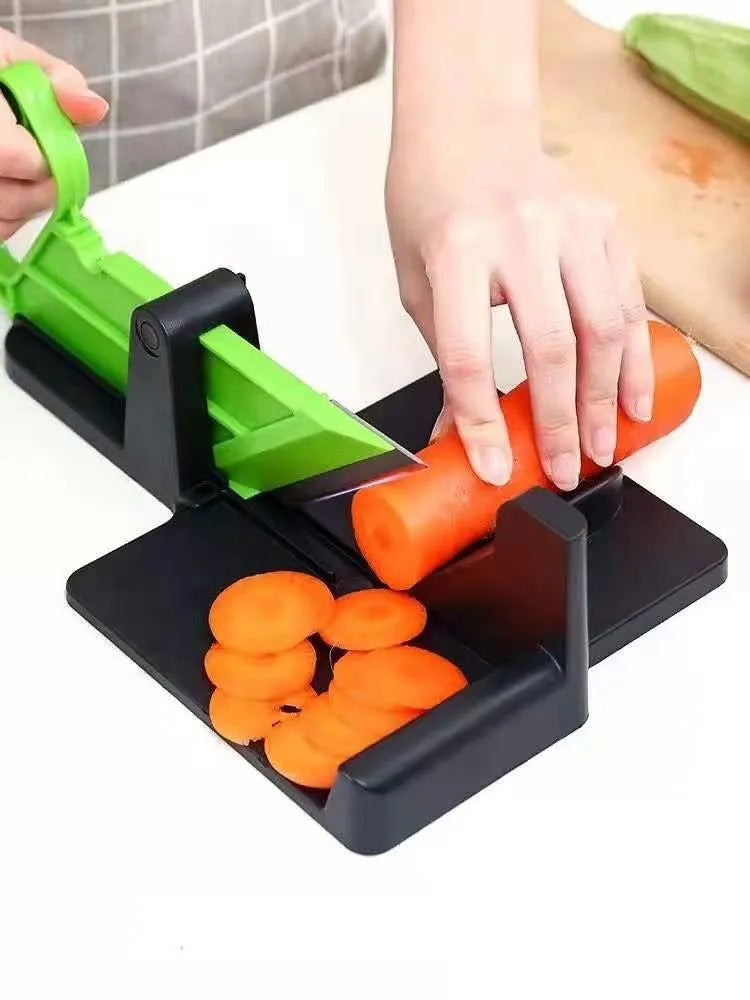 Green manual vegetable cutter with stainless steel blades for chopping carrots and potatoes