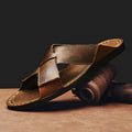 Men's black casual slip-on sandals made from genuine pigskin leather with a frosted finish and rubber sole.