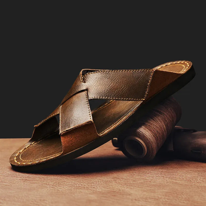 Men's black casual slip-on sandals made from genuine pigskin leather with a frosted finish and rubber sole.