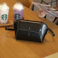 Women's brown oil wax cowhide shell-shaped crossbody messenger bag with visible stitching