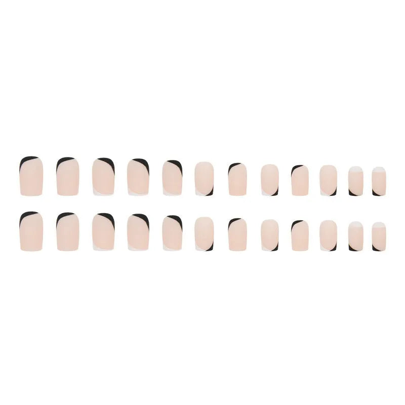 Black and white frosted matte false nails with French style design on display
