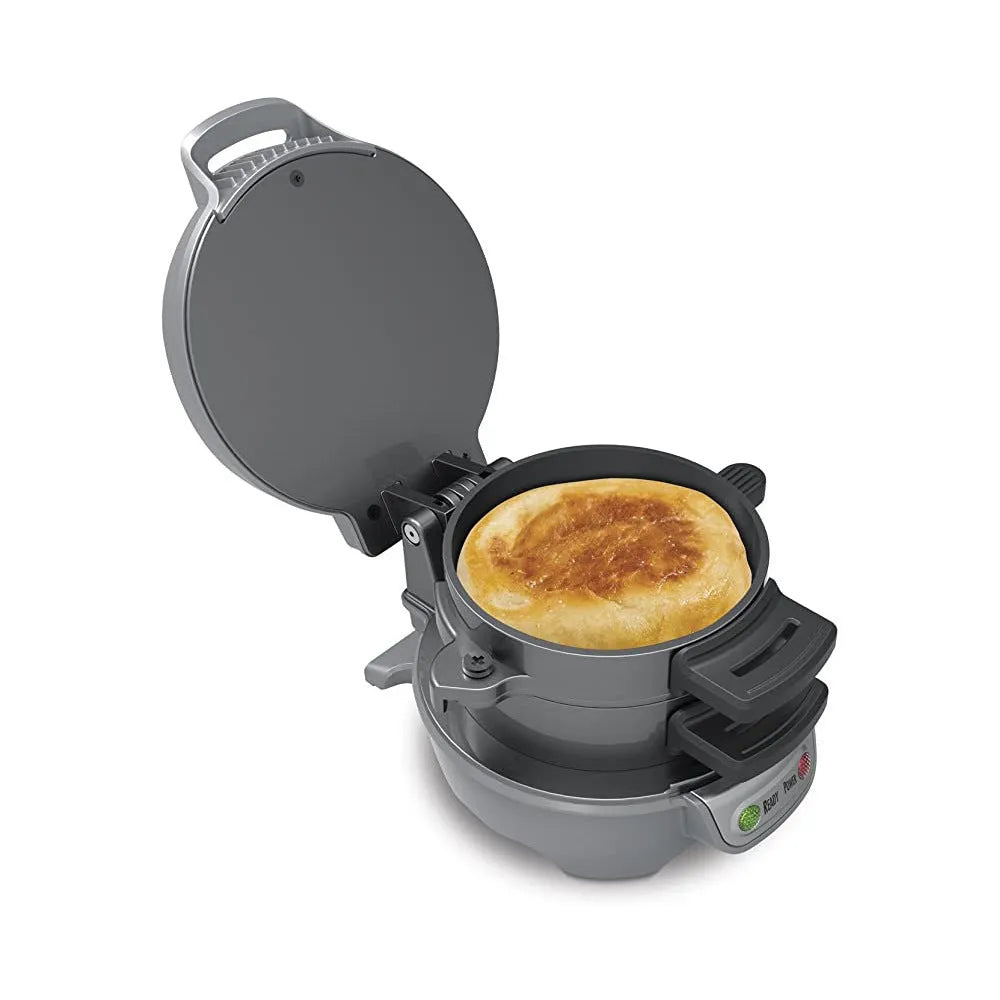 Bright red household breakfast machine with sandwich plates and egg cooking ring on kitchen counter