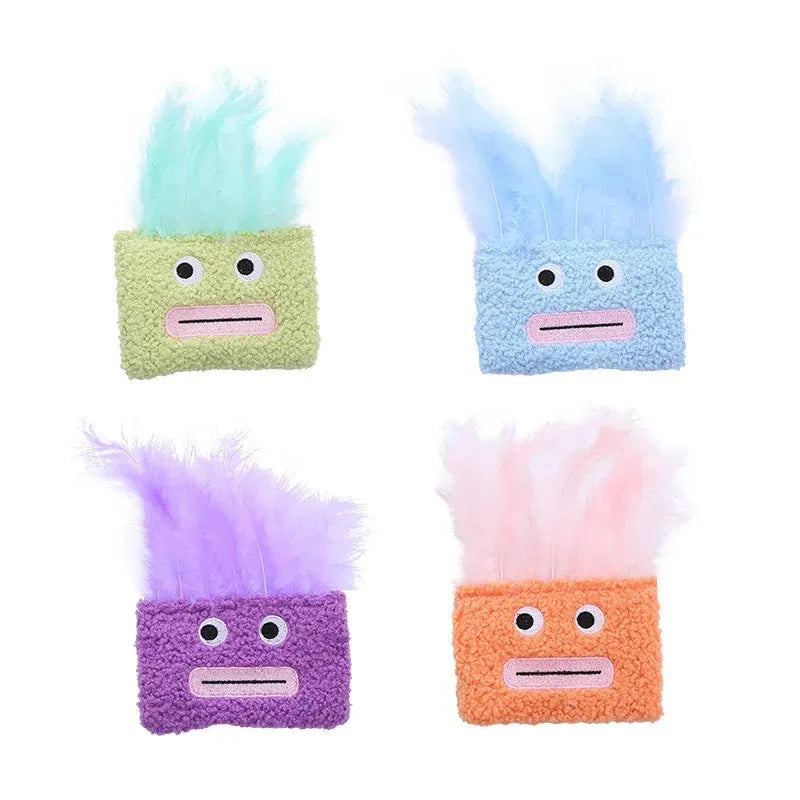 Colourful plush cat toy shaped like an explosion head with a big open mouth, shown in blue.