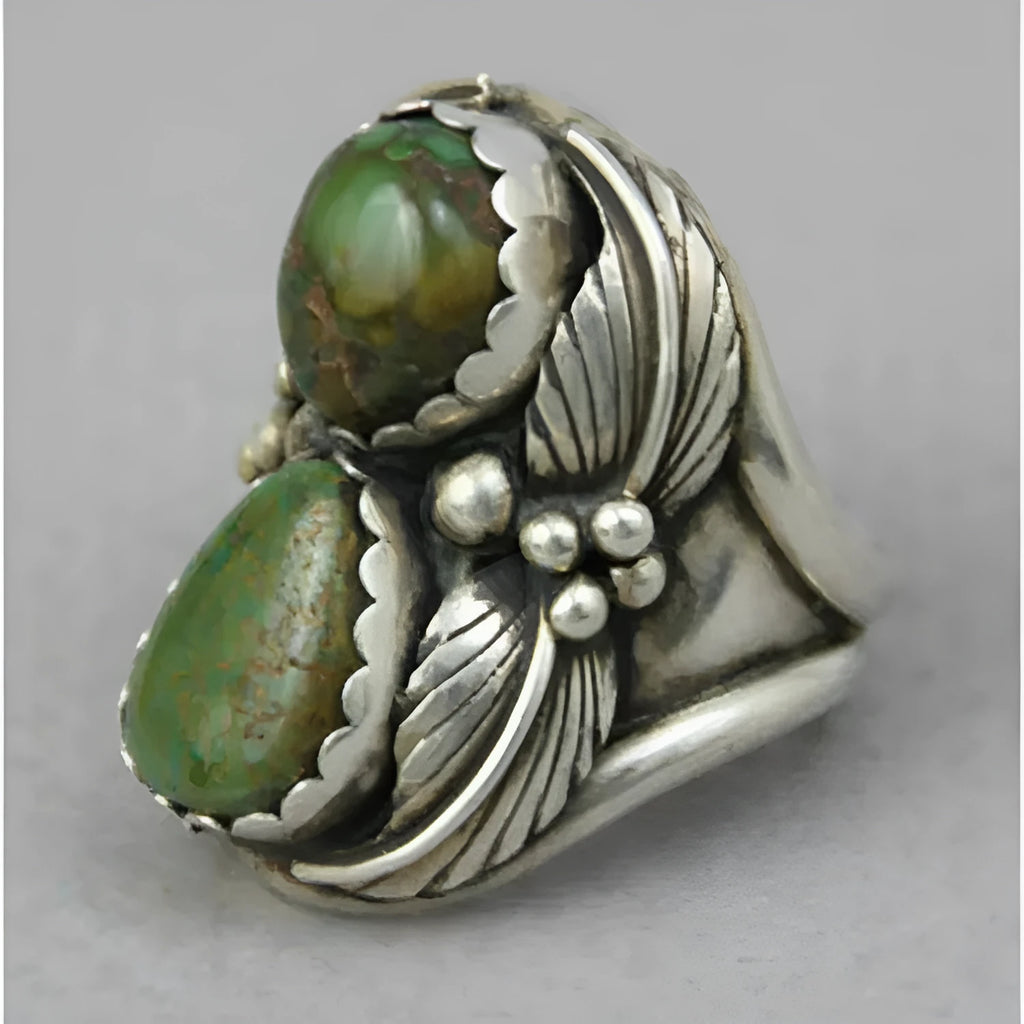 Women's geometric turquoise alloy ring with electroplated finish shown on finger