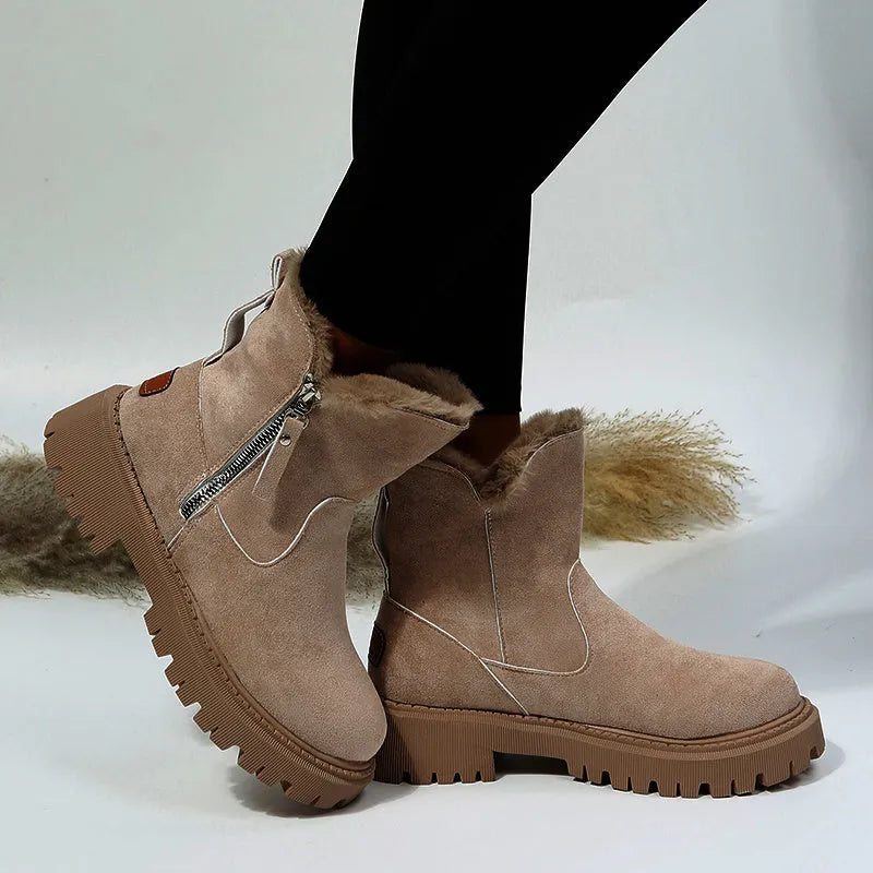 Women's black high-top faux suede snow boot with side zipper and non-slip sole.