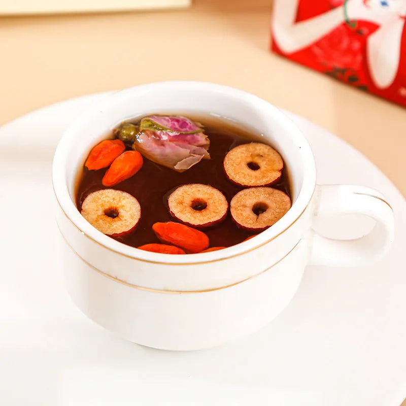 Box of ginger and jujube herbal tea with brown sugar, red dates, and wolfberries