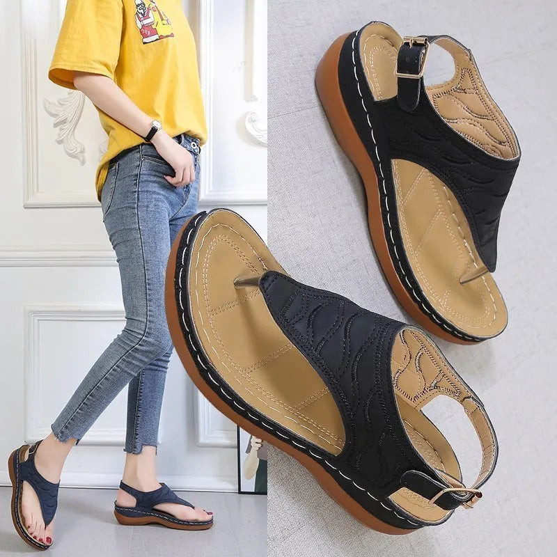 Women's casual wedge heel flip flop sandals with an adjustable buckle strap in solid colours.
