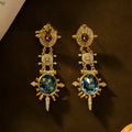 Pair of geometric gold retro stud earrings with diamond treatment surface