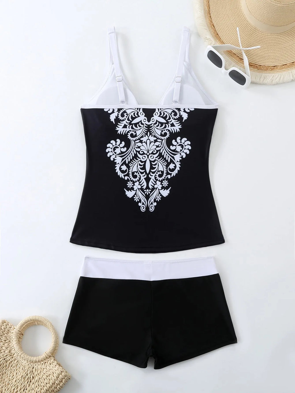 Plus size women's swimsuit with matching briefs in black or rose red print styles