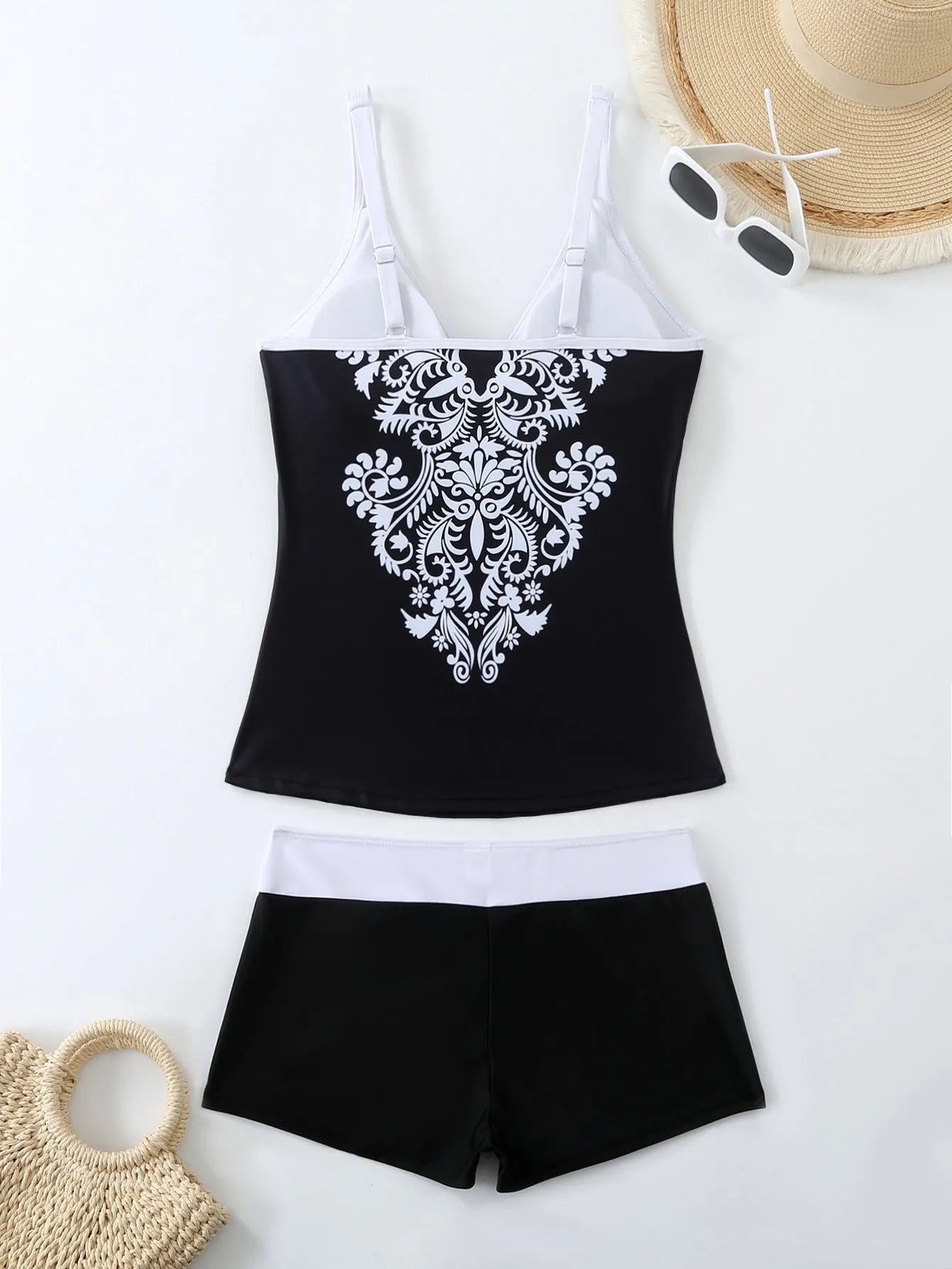 Plus size women's swimsuit with matching briefs in black or rose red print styles