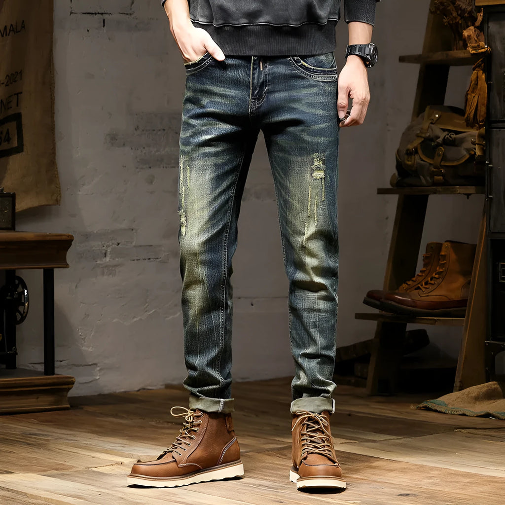 Men's retro colour skinny jeans with a zip fly, shown laid flat.