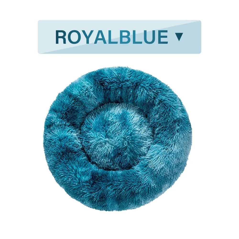 Fluffy donut-shaped dog bed in long plush fabric, showing raised rim and available colour options