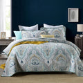 American style quilted cotton bed cover set with matching pillowcases on bed