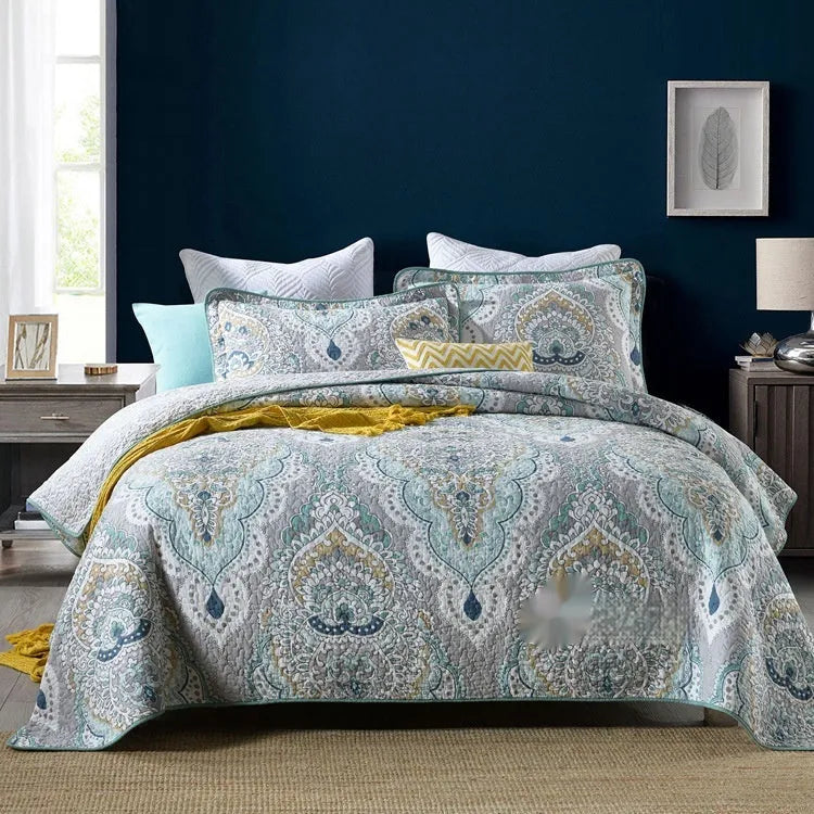 American style quilted cotton bed cover set with matching pillowcases on bed