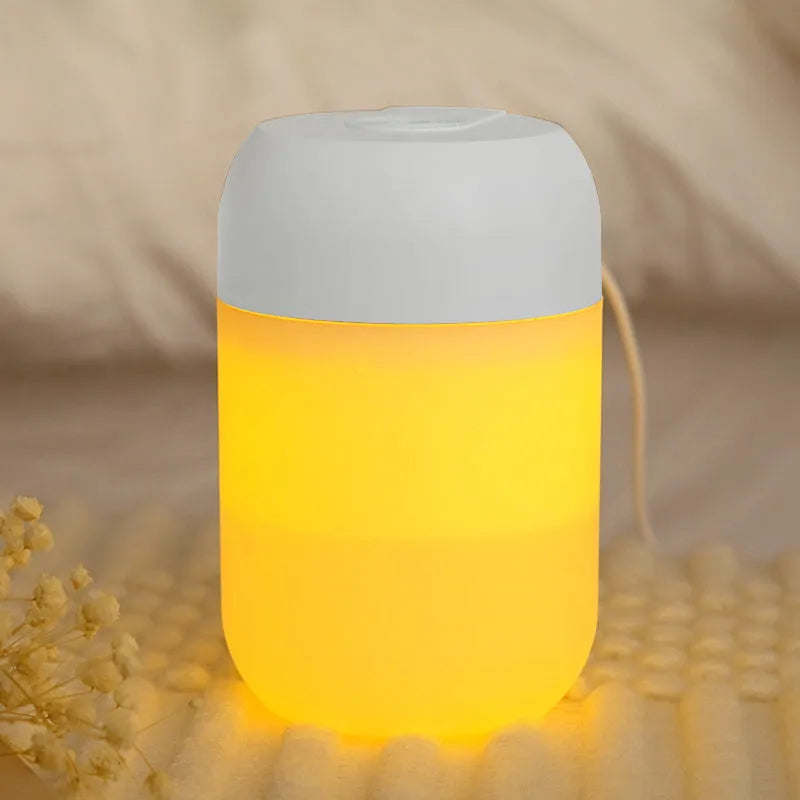 White cylindrical USB-powered mini humidifier with charging cable