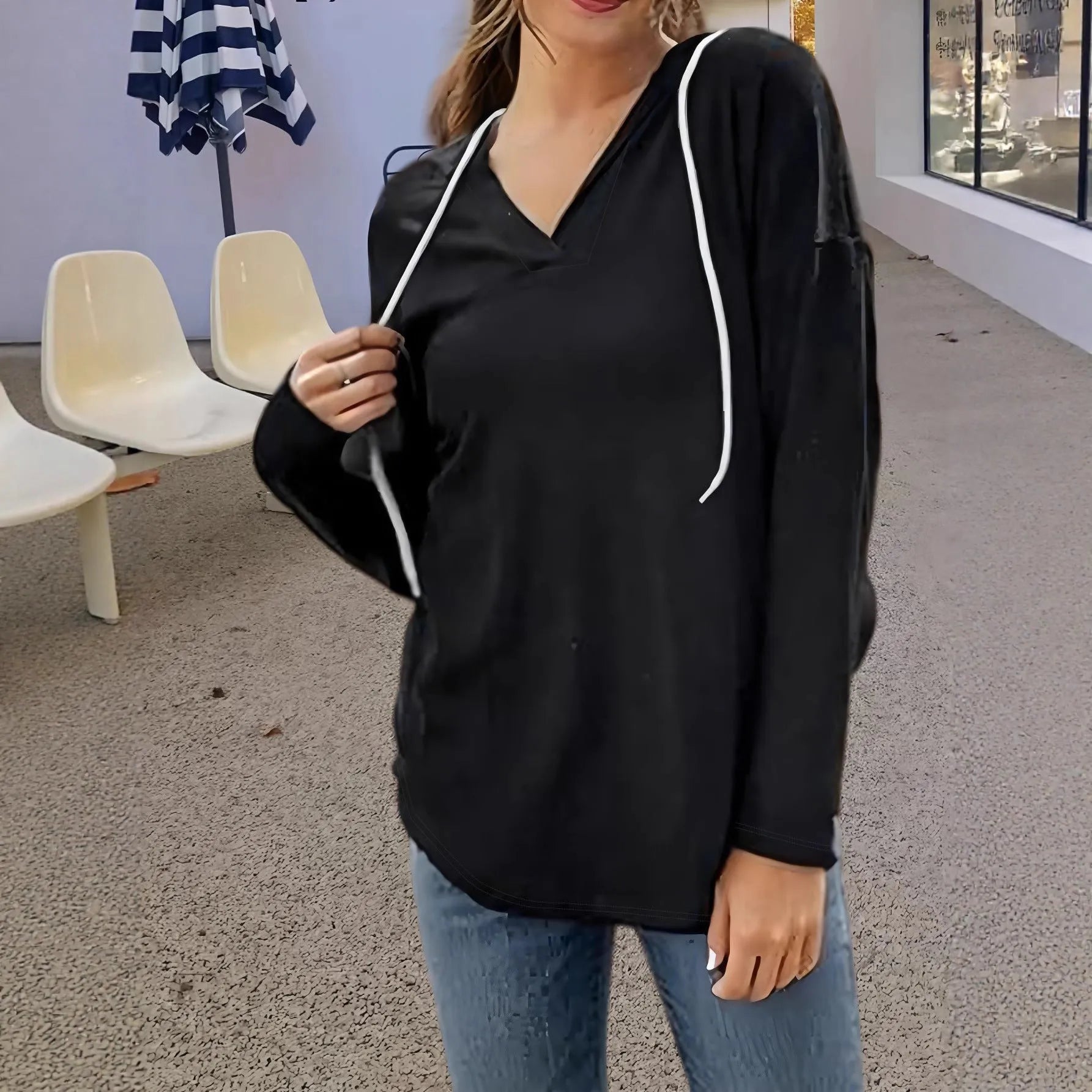 Women's red hooded V-neck sweatshirt with long sleeves on hanger