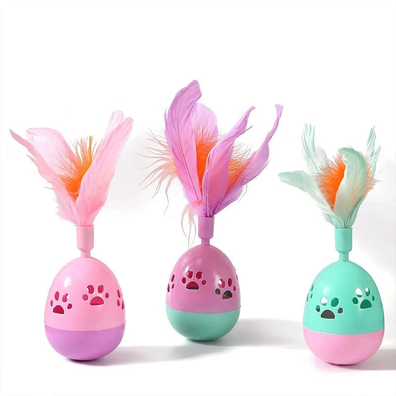 Tumbler bell cat toy in pink purple green, 15cm ABS plastic body with feathers and 6.5cm base