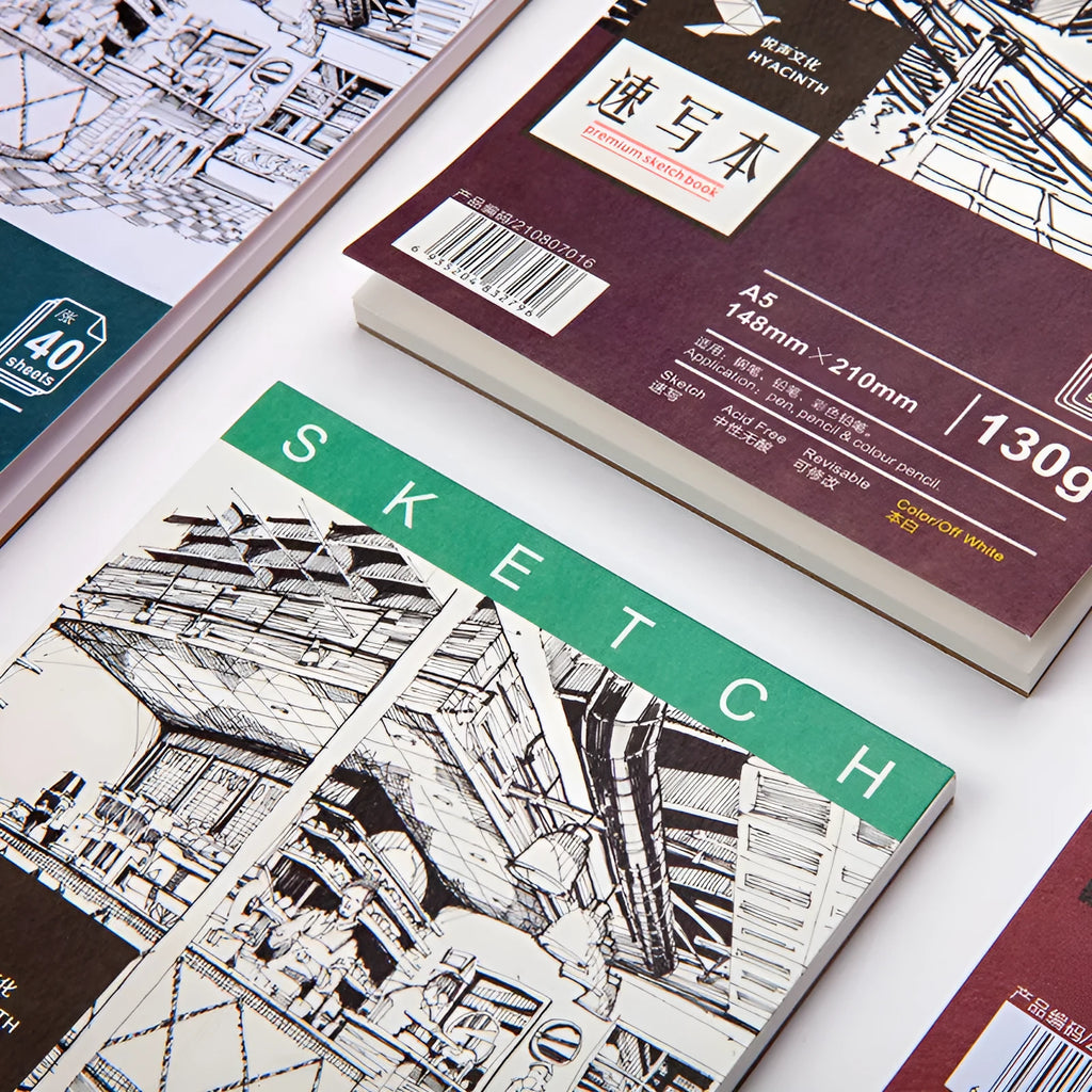 A4 sketchbook with spiral coil binding and white paper, shown open.