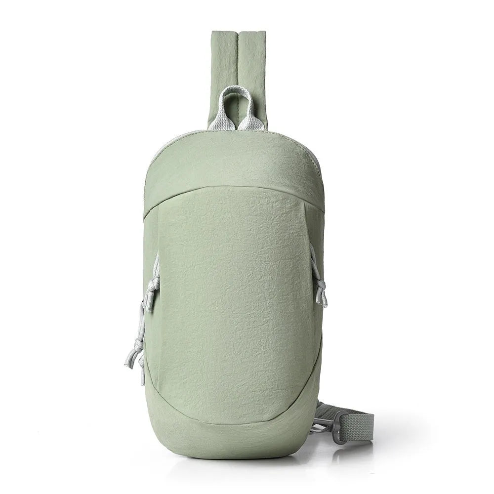 Outdoor crossbody bag in nylon shown in Army Green colour with a visible phone compartment.