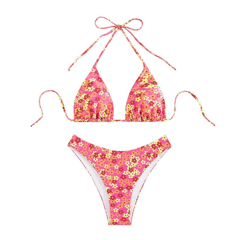 Blue printed women's swimsuit with lace-up detail and split design, includes top and shorts