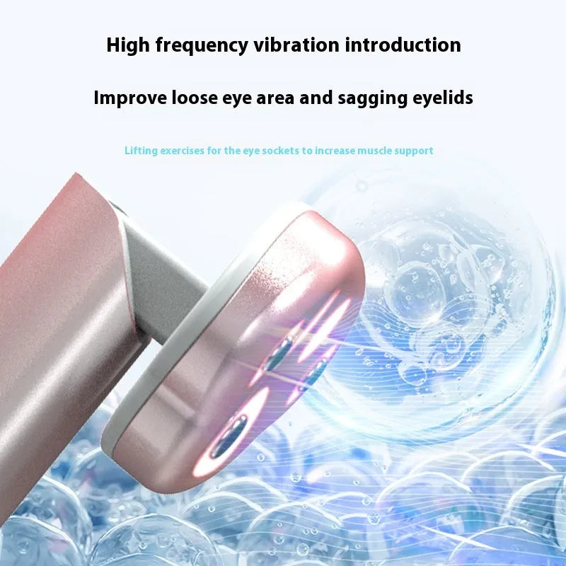 Cat's paw shaped micro-current eye massager in gradient pink with charging cable