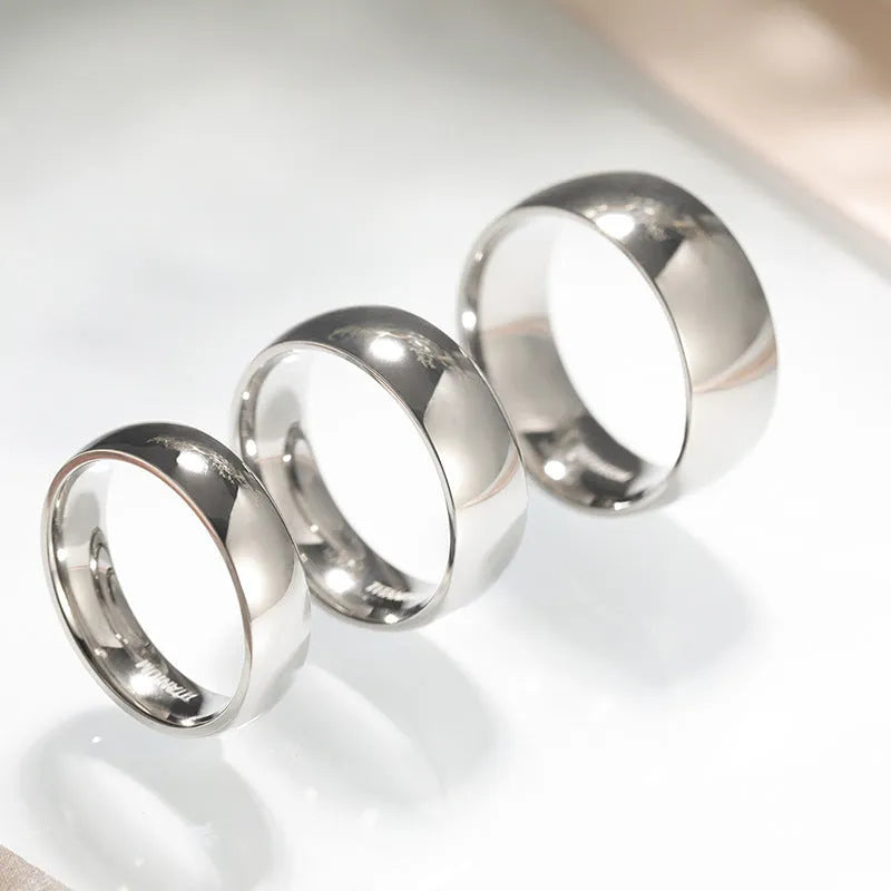 Silver-colour titanium steel unisex fashion ring shown in 2mm, 4mm, 6mm, and 8mm width options.