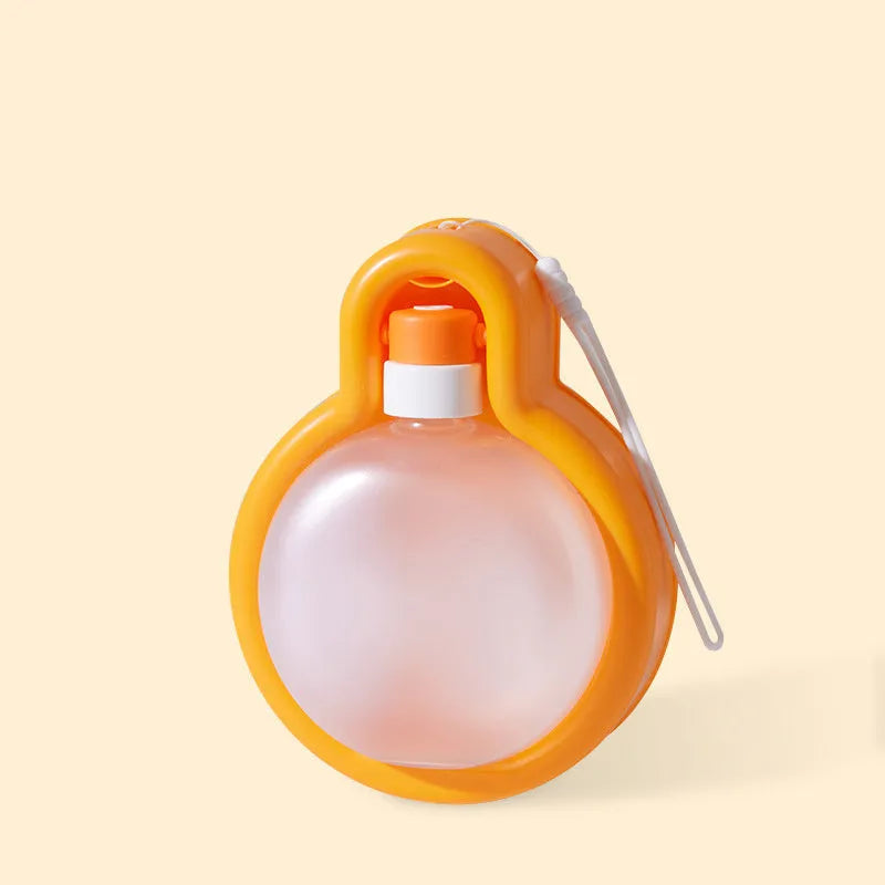 Green dog travel water bottle with pull-out drinking bowl for outdoor use