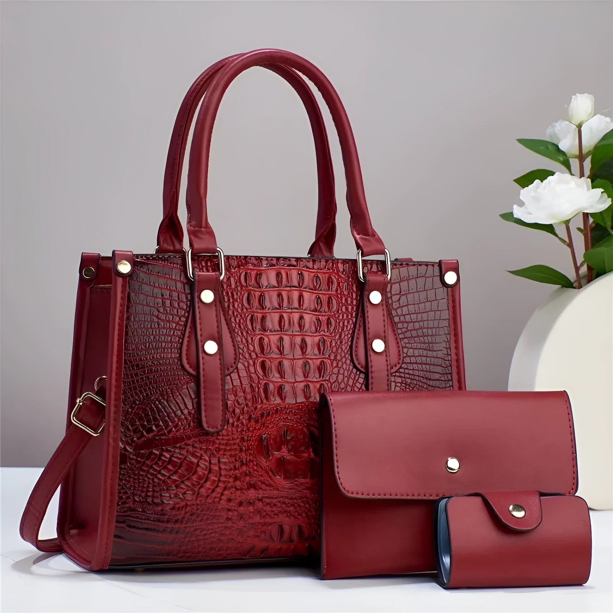 Women's three-piece bag set showing bucket crossbody bag, wallet and card holder in matching colour