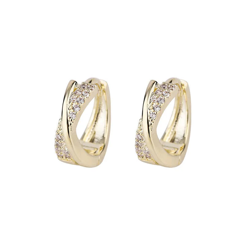 A pair of geometric drop earrings with zircon crystals in a 14K yellow finish.