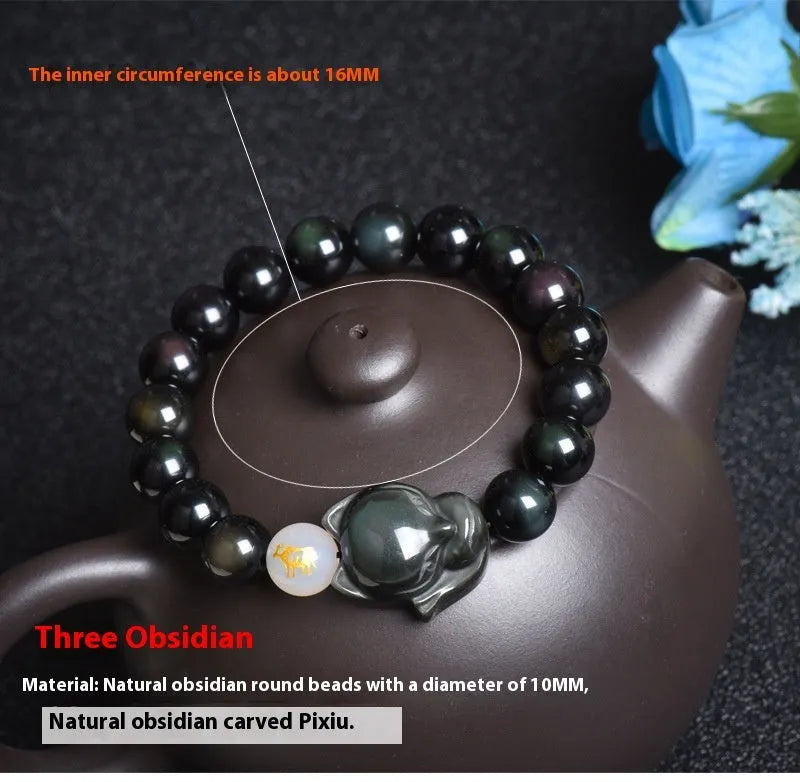 Adjustable obsidian zodiac bracelet with 10mm beads on a wrist.