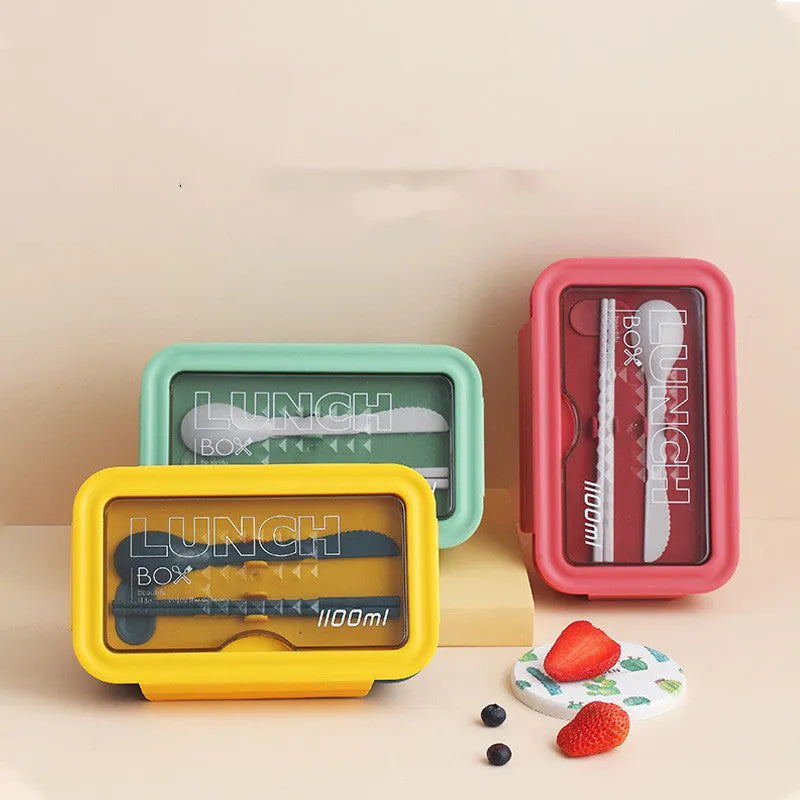 Green four-layer partitioned bento lunch box showing compartment separation