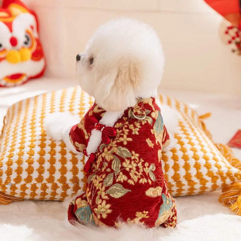 Lunar New Year brocade pet jumpsuit with faux fur trim, Chinese knot buttons and floral-gold motifs in red or beige.