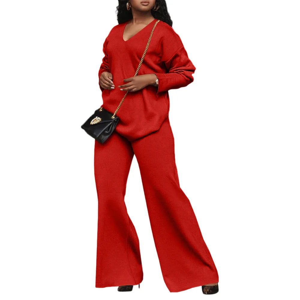Brown women's long-sleeve suede top and trousers two-piece casual suit on a hanger.
