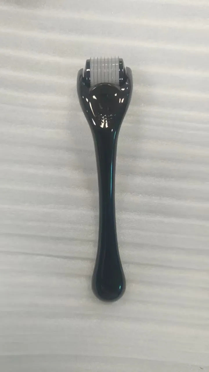 Sterile 540 micro needle derma roller showing handle and needle wheel in assorted colours.