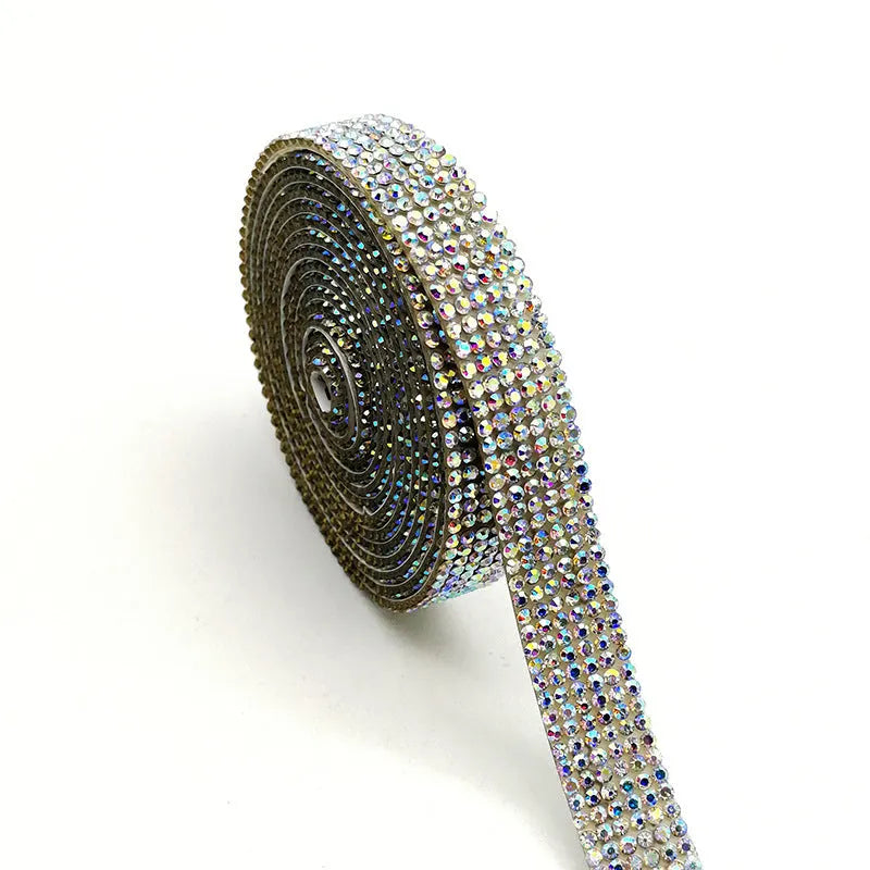 A long strip of self-adhesive, sparkly glass water drill trim on a white background, showing white and AB colour options.