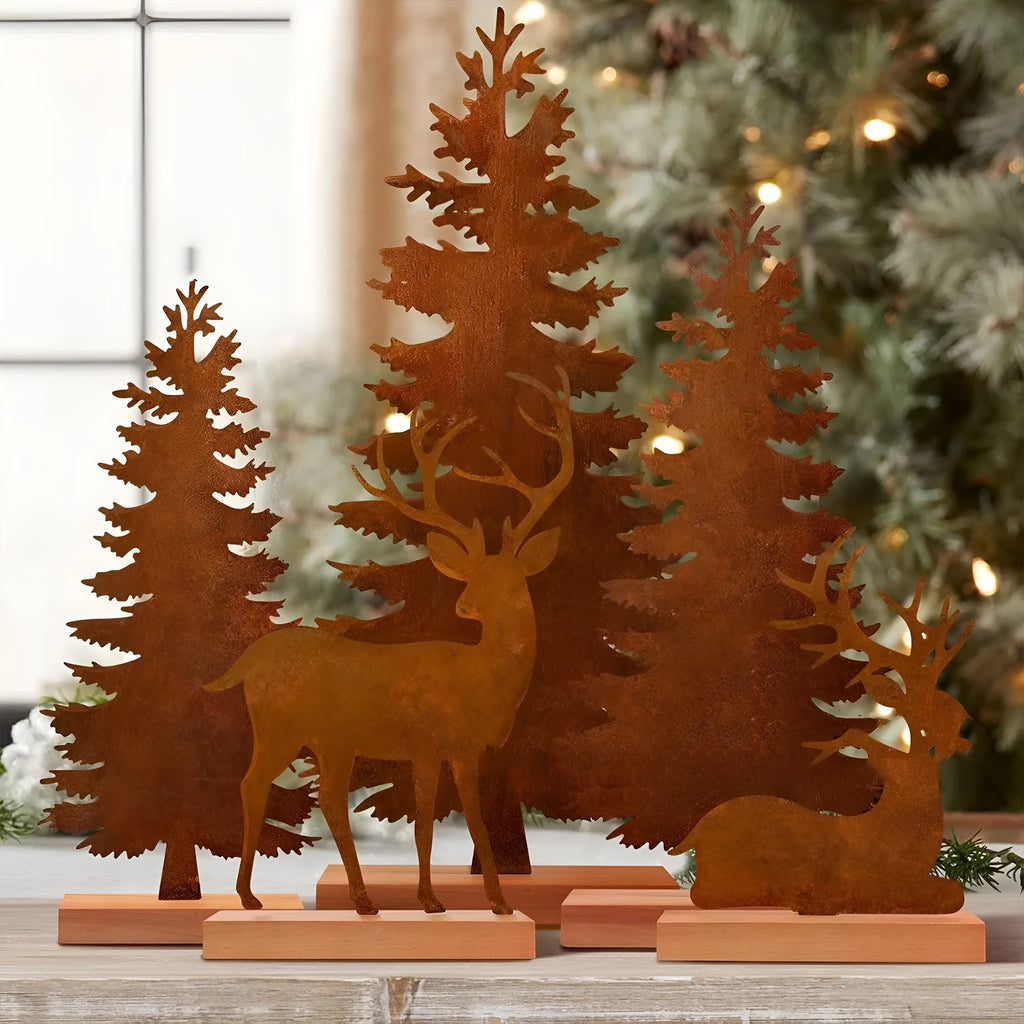 Set of three rustic metal Christmas ornaments featuring elk and tree silhouettes with an aged iron finish.