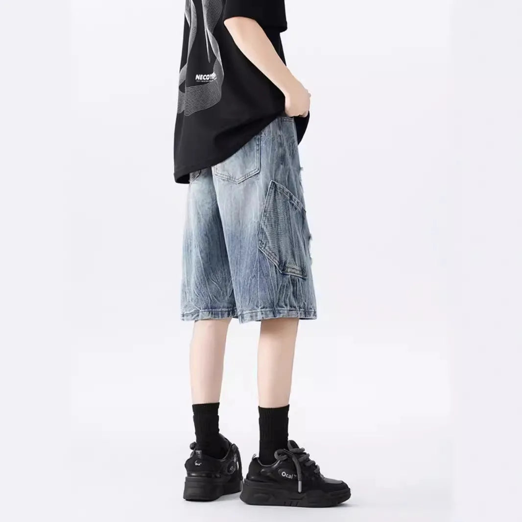 Black and Blue ripped denim shorts with a washed vintage finish and loose, retro fit.