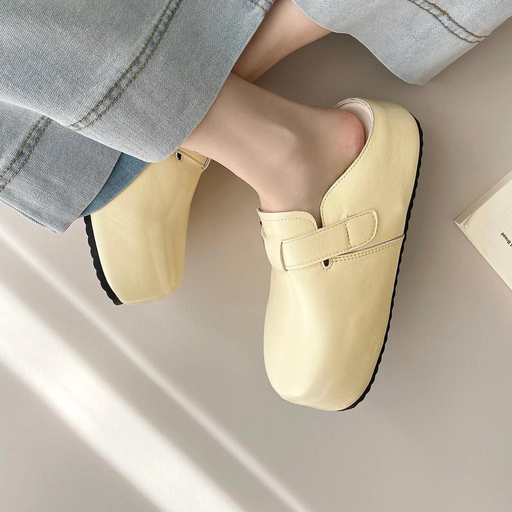 Flat casual sneakers with a buckle fastening and round toe in multiple colour options.