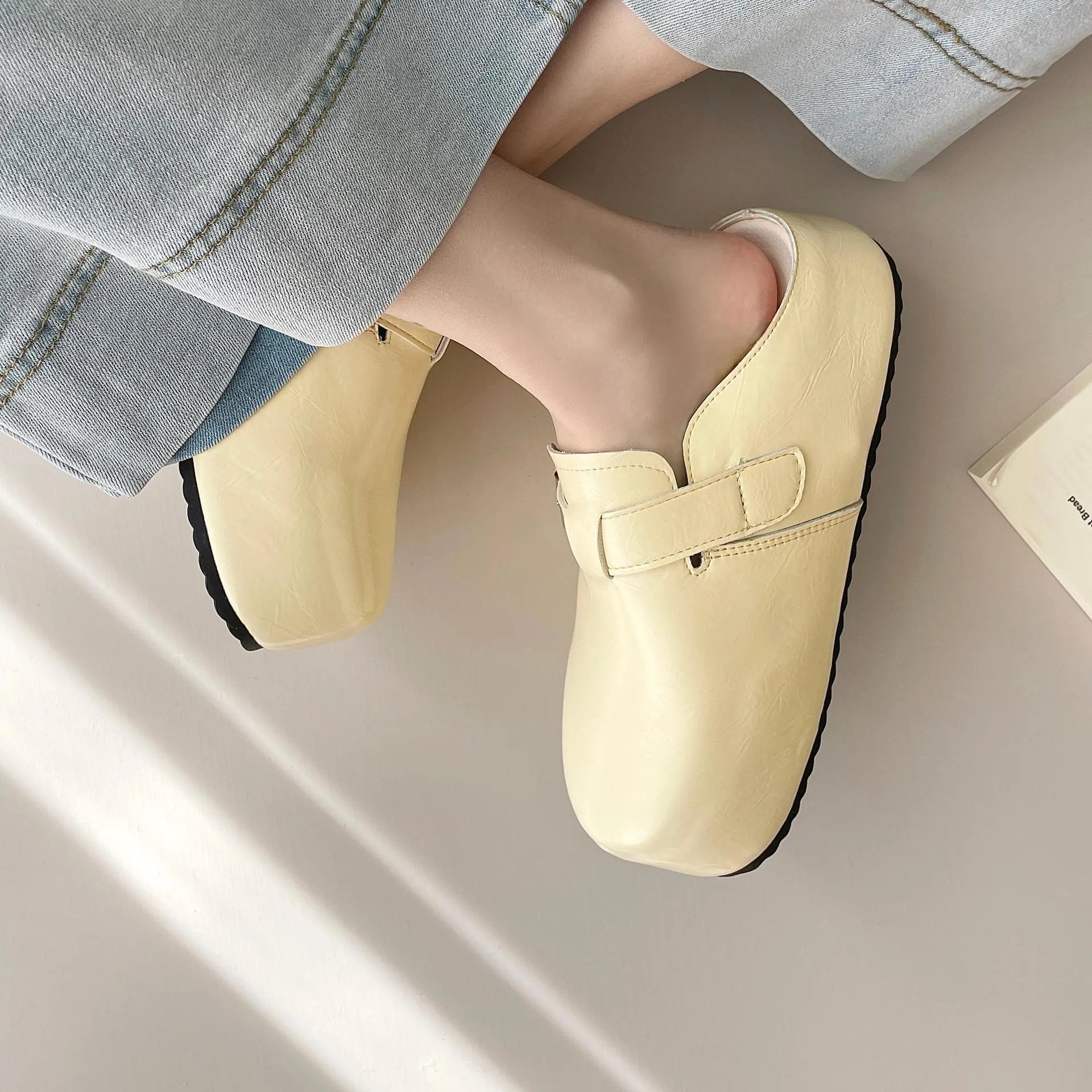 Flat casual sneakers with a buckle fastening and round toe in multiple colour options.