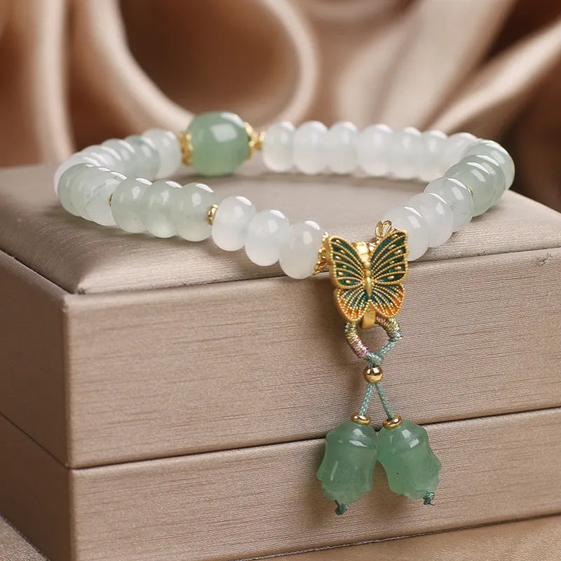 Green retro butterfly tassel bracelet with crystal beads, pearls, and rhinestones