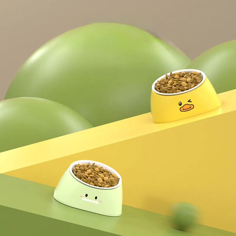 Green tilted stainless steel cat bowl with non-slip white base at a 15 degree angle