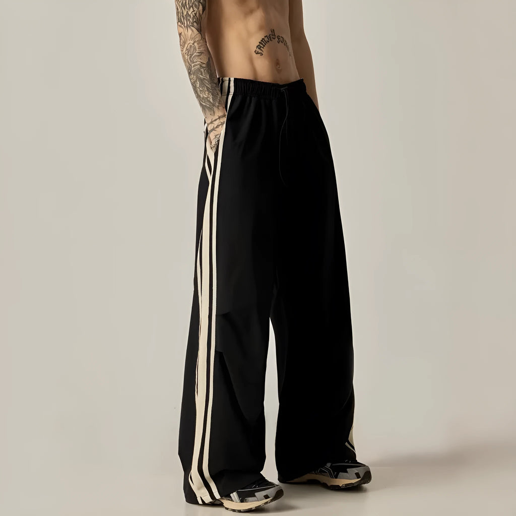 Men's black wide-leg climbing trousers with high waist and straight leg design