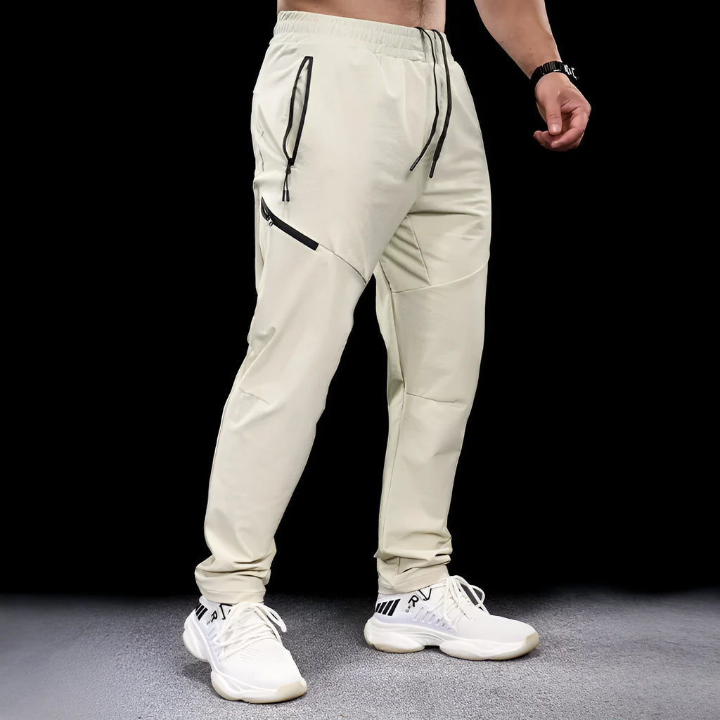 Men's black waterproof quick-drying nylon workout pants for sports and exercise.