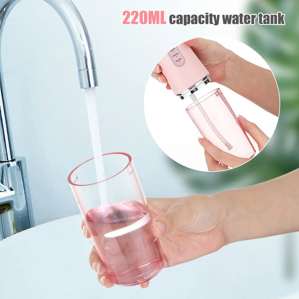 Handheld electric water flosser in white, pink, light green, or white-green with three speed settings, four nozzles, and USB cable