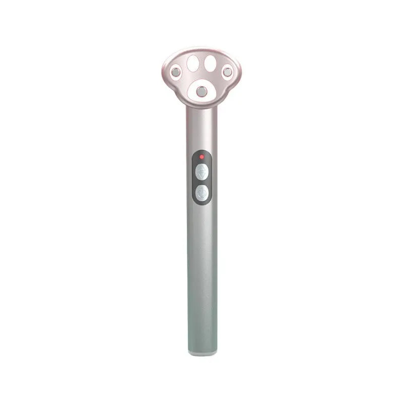 Cat's paw shaped micro-current eye massager in gradient pink with charging cable