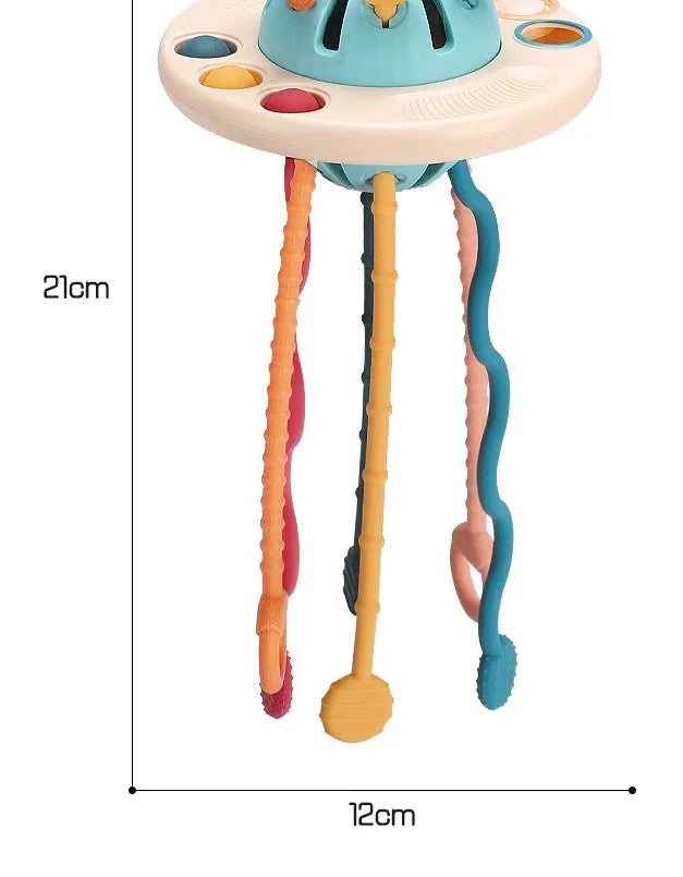 Silicone sensory training toy for baby, 12x21cm flying saucer shape with pull rope and small ball, Montessori finger toy for 18m+.